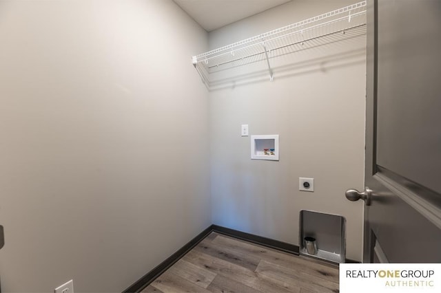 washroom featuring washer hookup, light wood-type flooring, and hookup for an electric dryer