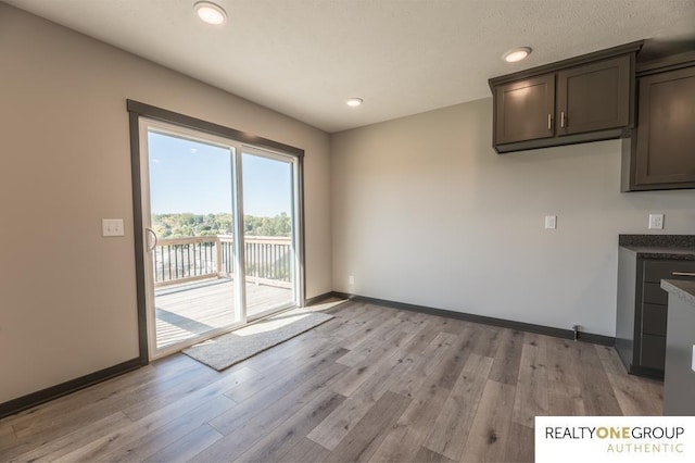 unfurnished dining area featuring light hardwood / wood-style floors