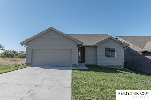 single story home with a front yard and a garage