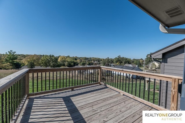 deck featuring a lawn