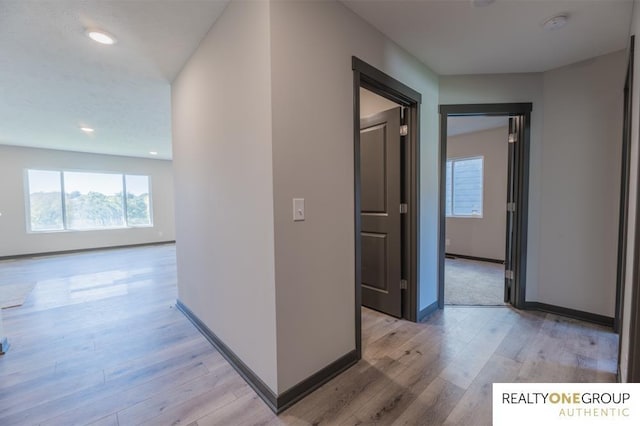 hallway featuring light hardwood / wood-style flooring