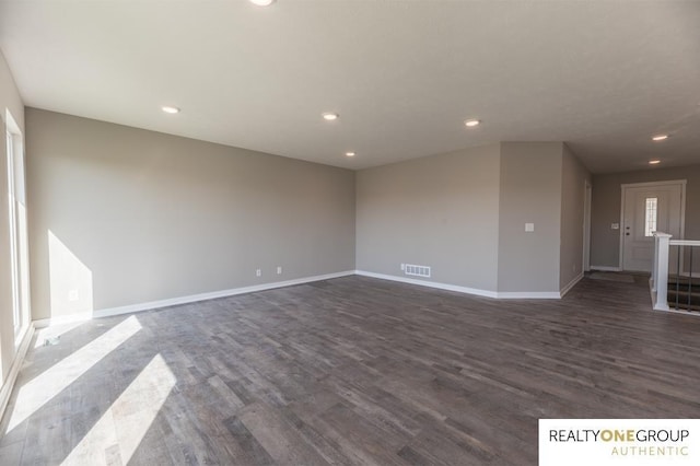 empty room featuring dark wood-type flooring