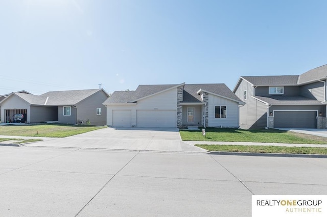 view of front facade with a front lawn and a garage