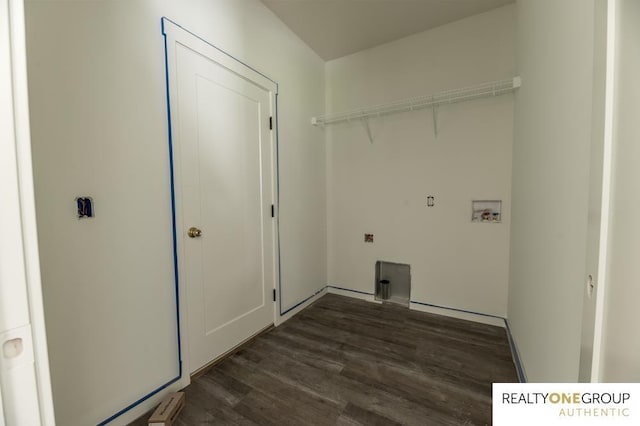 laundry room with dark hardwood / wood-style flooring and washer hookup