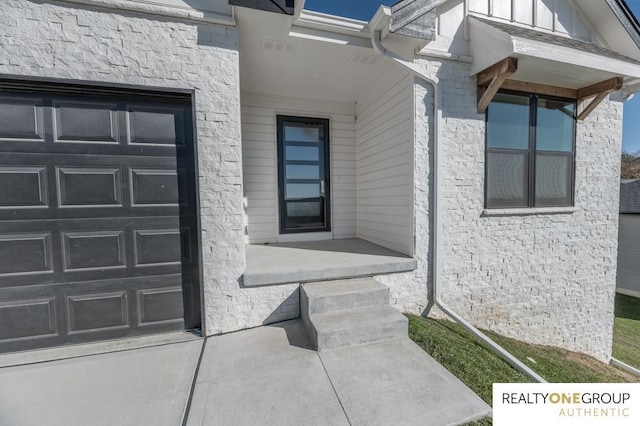 property entrance with a garage