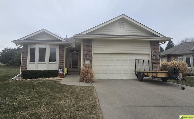 ranch-style house with a garage and a front lawn