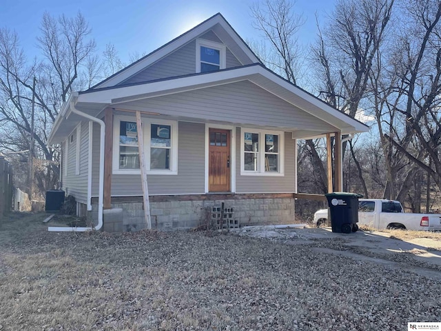 view of front of home featuring central AC unit and a porch