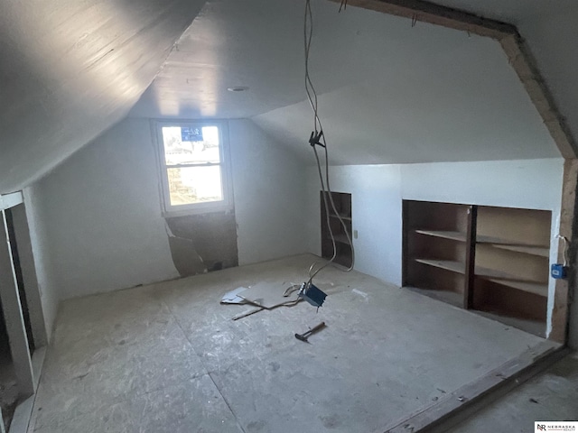 additional living space with lofted ceiling