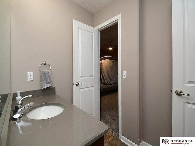 bathroom featuring vanity and a textured ceiling