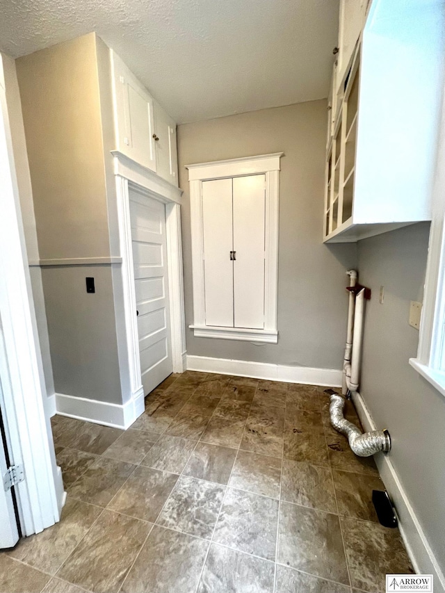 washroom featuring a textured ceiling