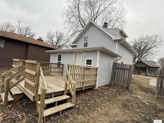 back of property featuring a wooden deck