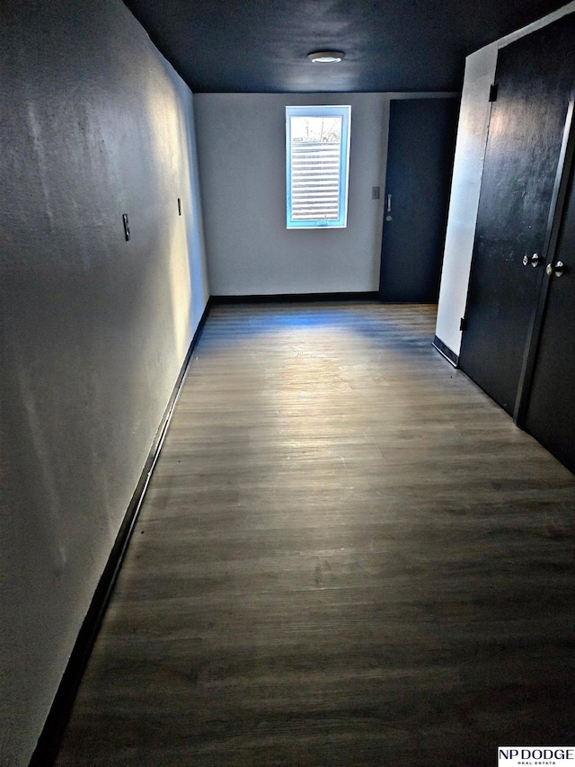 spare room with dark hardwood / wood-style floors