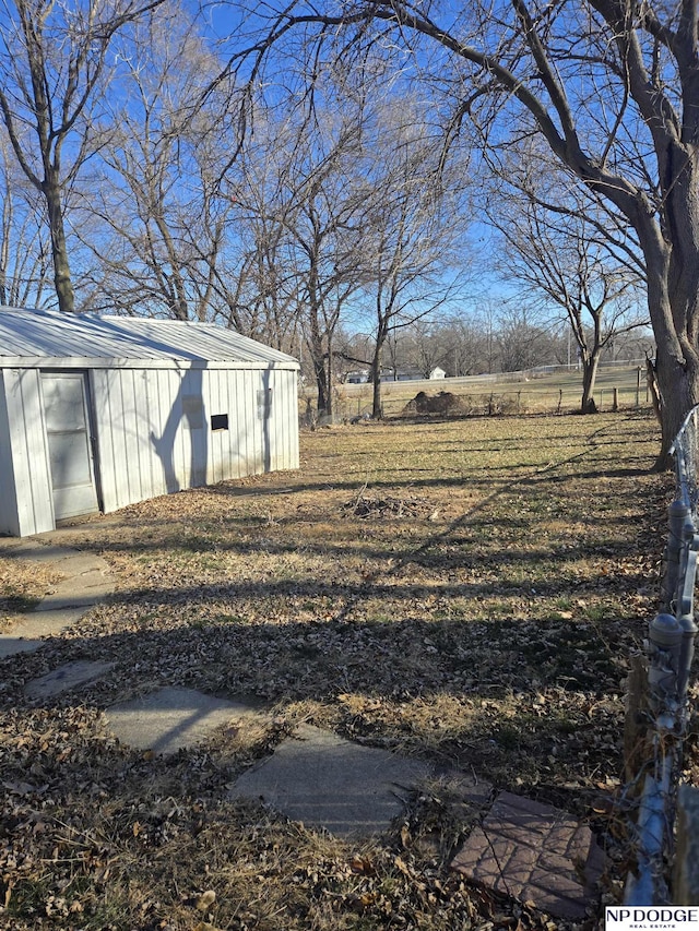 view of yard with a rural view