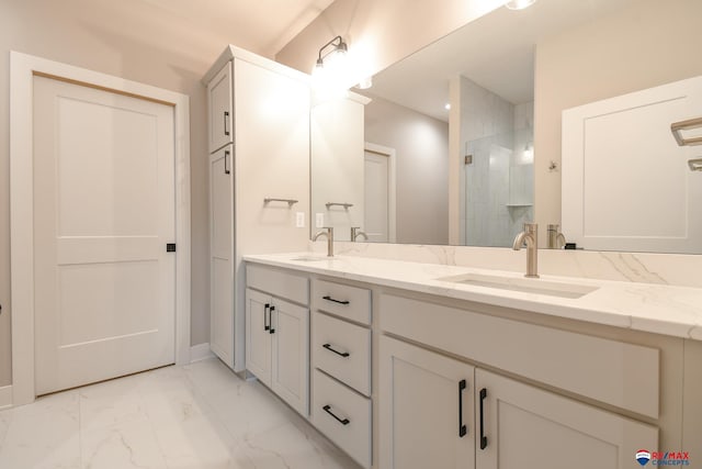 bathroom featuring vanity and a shower with shower door