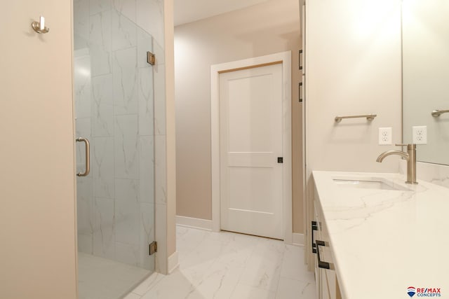 bathroom featuring vanity and an enclosed shower