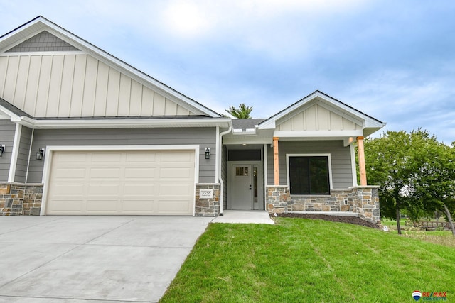 craftsman-style home featuring a front yard and a garage