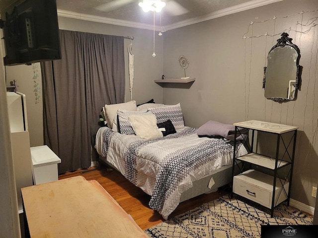 bedroom with wood-type flooring, ceiling fan, and crown molding