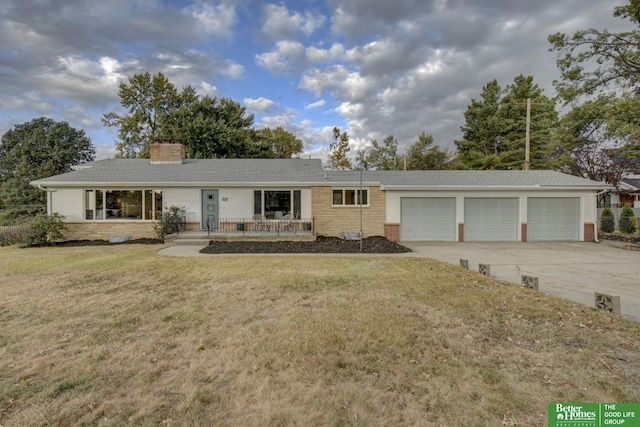 ranch-style home with a front yard and a garage