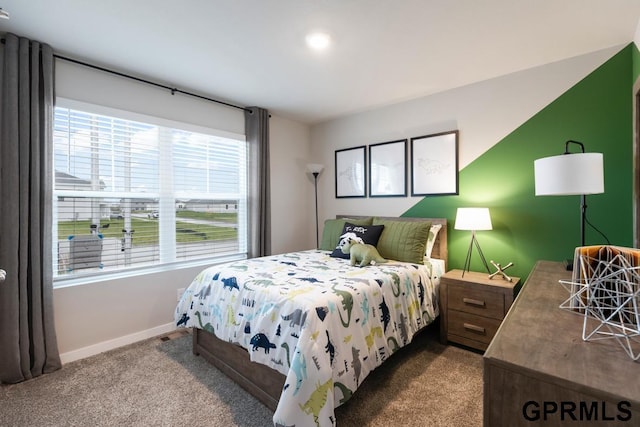 carpeted bedroom with multiple windows