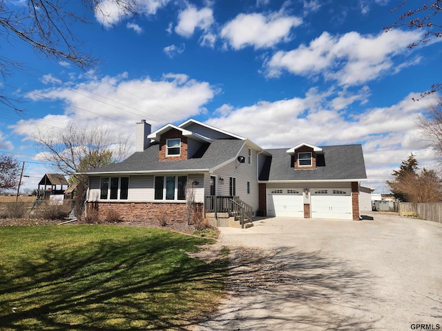 view of front facade with a front lawn and a garage