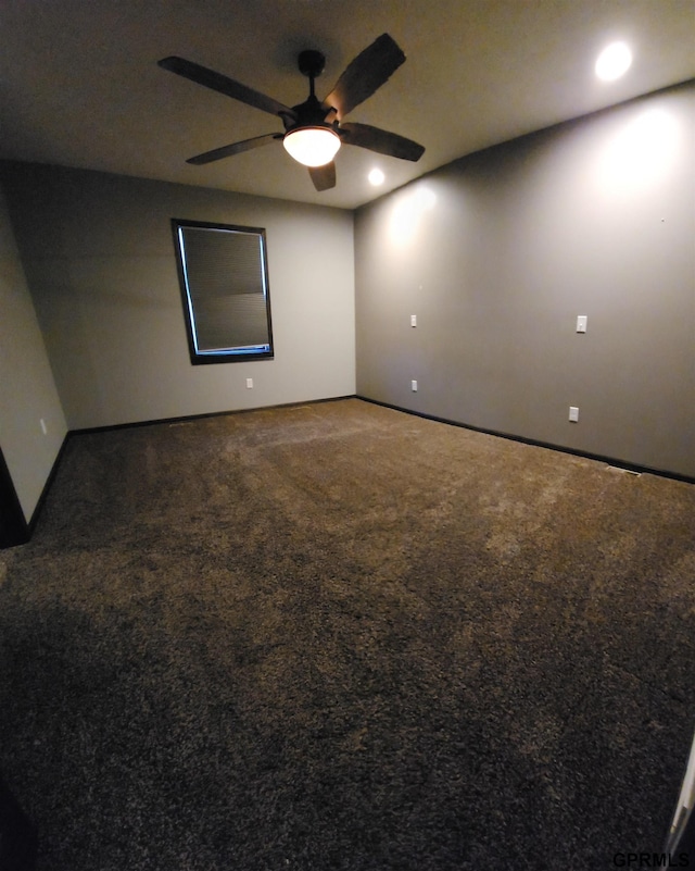 carpeted empty room with ceiling fan