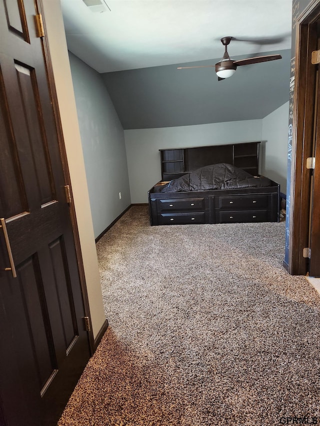 bedroom with carpet, ceiling fan, and lofted ceiling