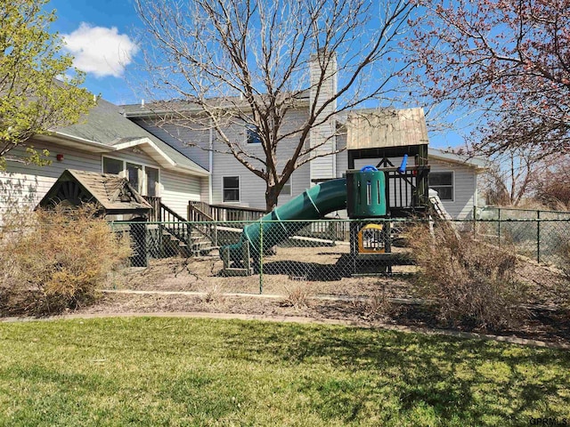 view of playground with a lawn