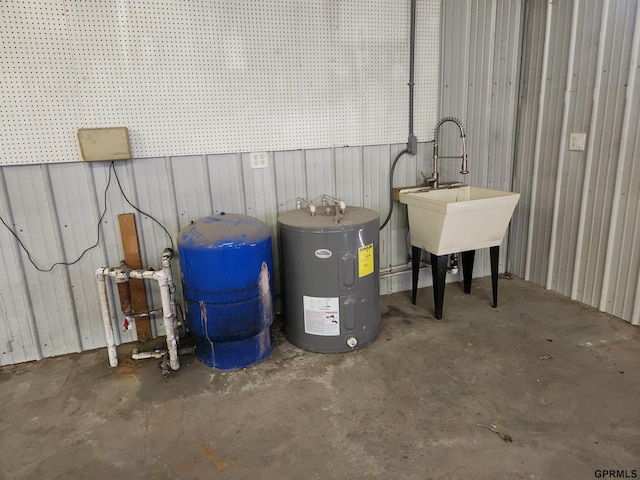 utility room featuring water heater