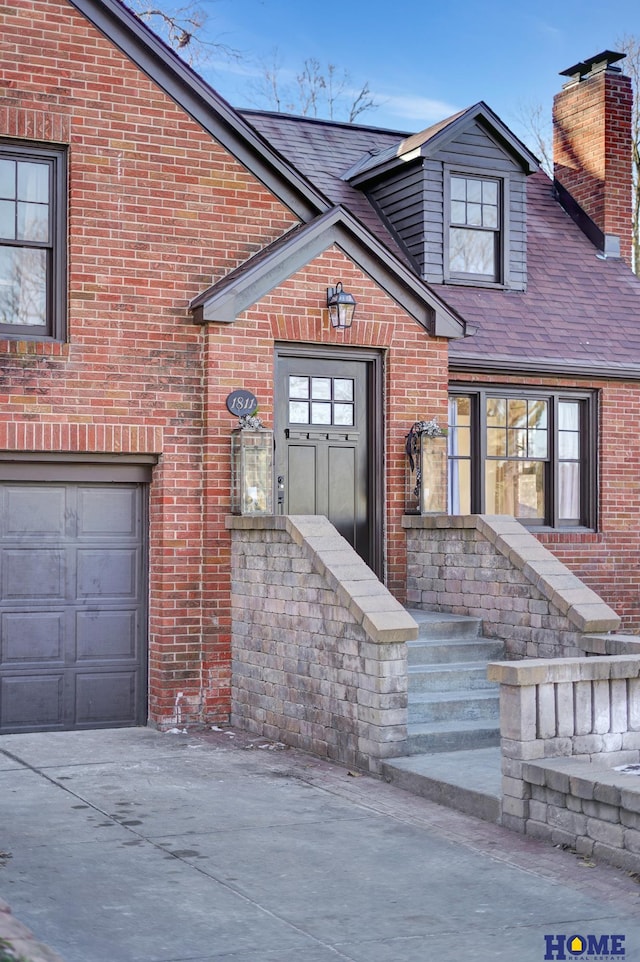 view of exterior entry featuring a garage