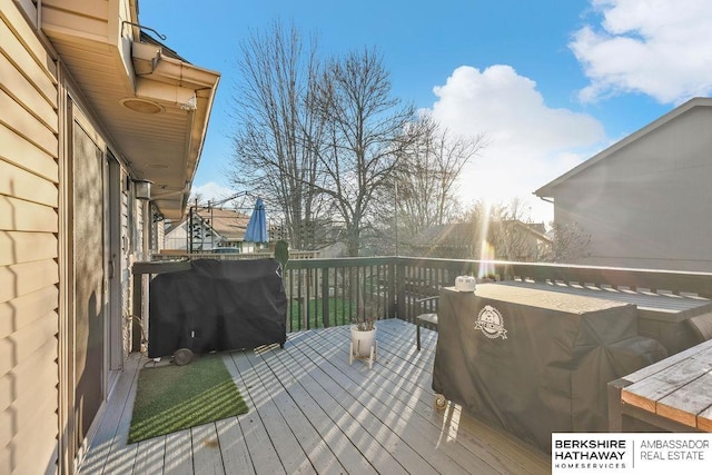 wooden deck with area for grilling