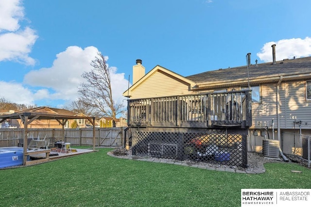 back of property featuring a deck, cooling unit, and a lawn