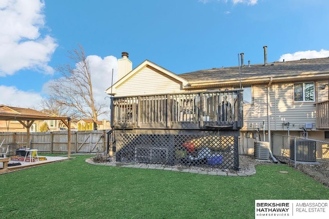 back of property featuring a lawn and a deck