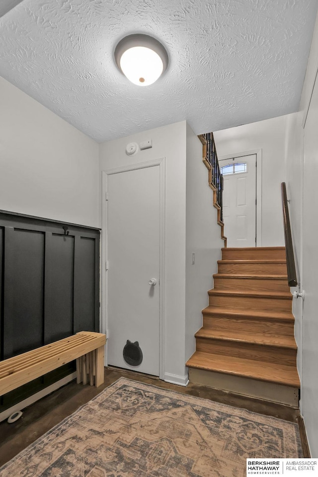 interior space with a textured ceiling