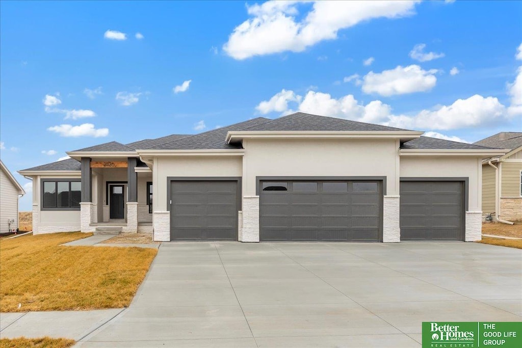 prairie-style house featuring a garage