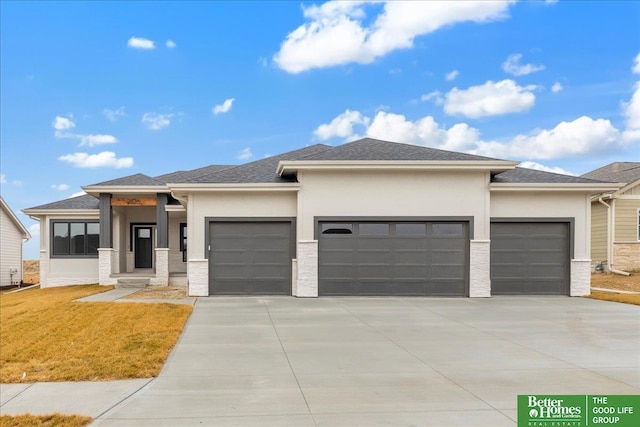 prairie-style house featuring a garage