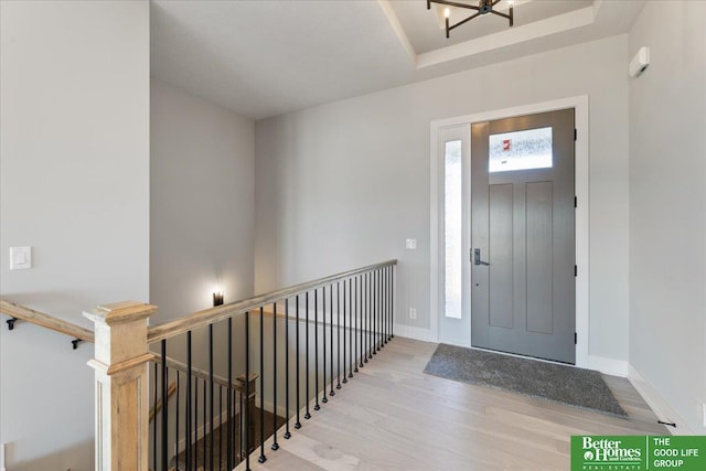 entrance foyer featuring an inviting chandelier and light wood-type flooring