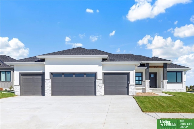 prairie-style house with a garage and a front yard