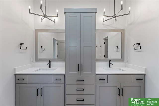 bathroom with vanity and a chandelier