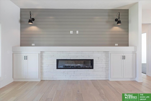 details with a fireplace and hardwood / wood-style floors