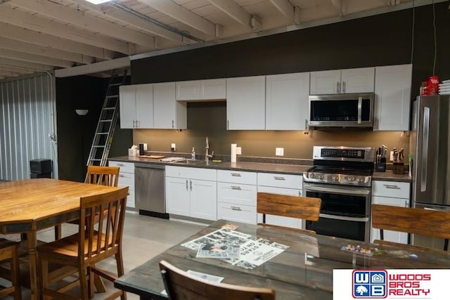 kitchen with white cabinets, stainless steel appliances, and sink