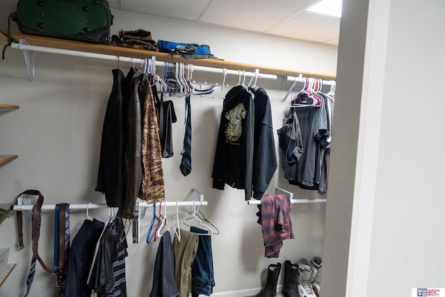 walk in closet featuring a drop ceiling