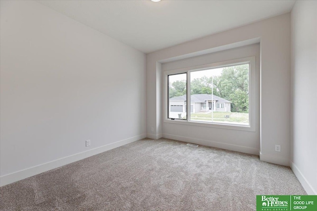 empty room featuring carpet flooring