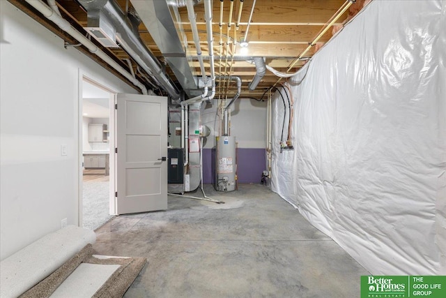 basement featuring gas water heater and heating unit