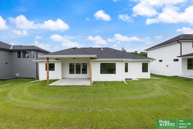 back of house featuring a yard and a patio