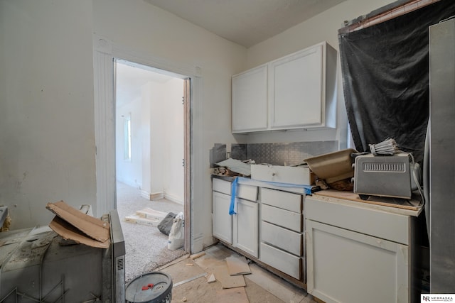 kitchen featuring white cabinets