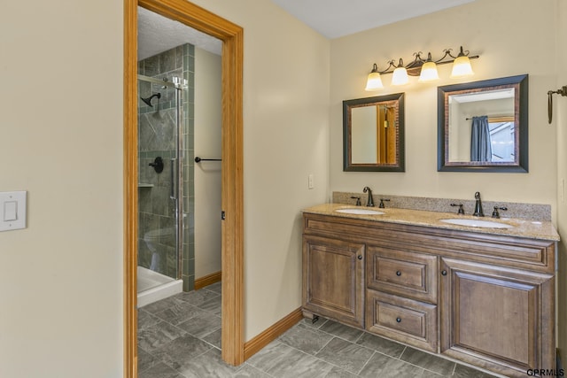 bathroom with tile patterned flooring, vanity, and an enclosed shower