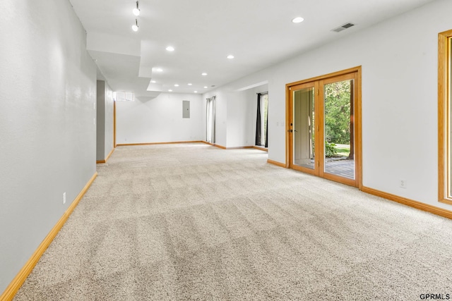 spare room with light carpet