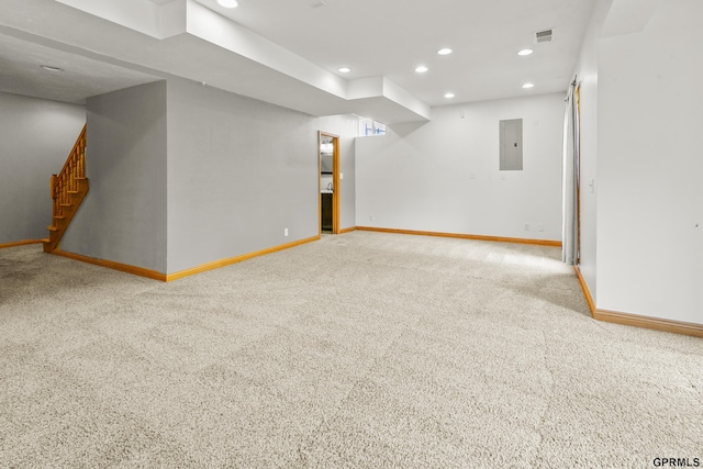 basement featuring carpet and electric panel