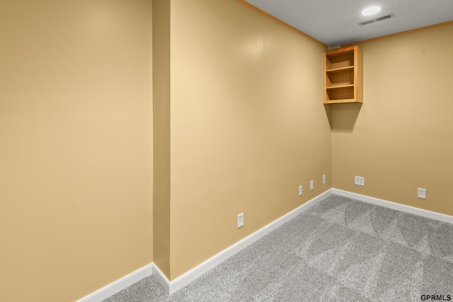 empty room with light colored carpet