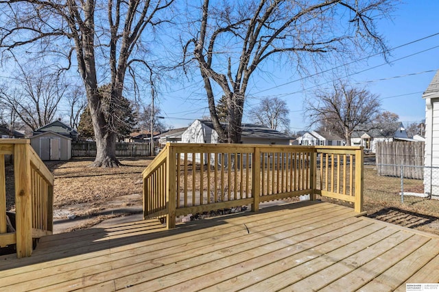 wooden deck featuring a shed